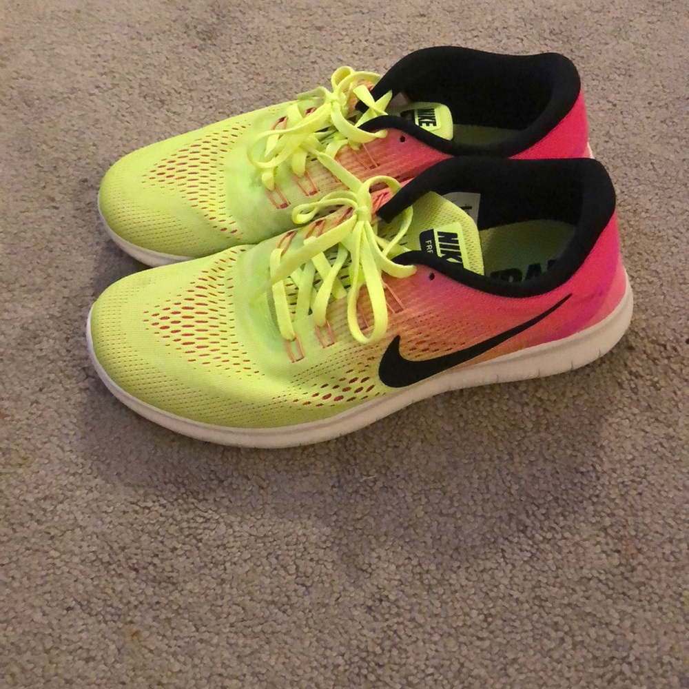 Pink and yellow nike free rn